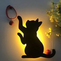 OptiLair cat-shaped wall night light with warm yellow glow and sound-sensor activation for bedroom decor