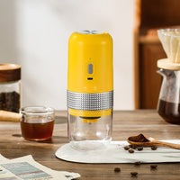 OptiLair portable electric coffee grinder in yellow with a clear powder silo and Type-C charging port.