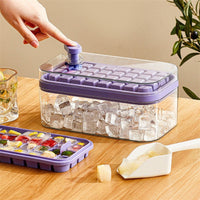 OptiLair purple one-touch ice cube tray and storage box with lid and shovel on a wooden table